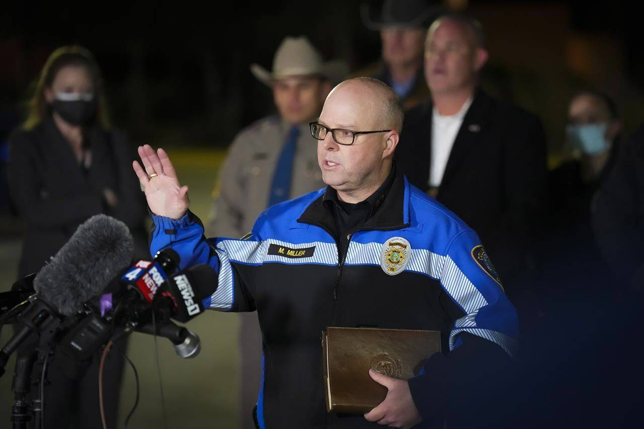 Colleyville police Chief Michael Miller addresses reporters in a nearby parking lot after the conclusion of a SWAT operation at Congregation Beth Israel synagogue on Saturday, Jan. 15, 2022, in Colleyville, Texas. All four people taken hostage inside the synagogue during a morning service were safe Saturday night after an hours-long standoff, authorities said. (Smiley N. Pool/The Dallas Morning News via AP)