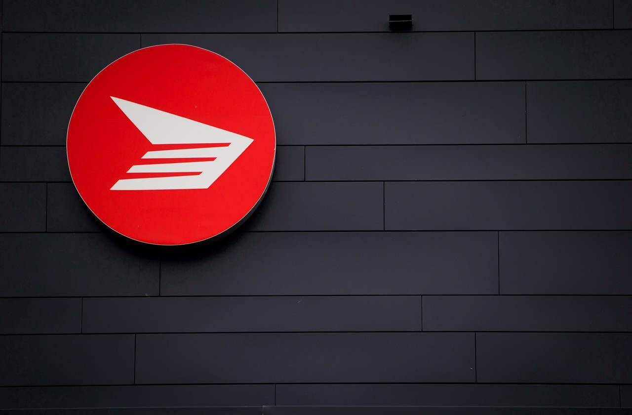 The Canada Post logo is seen on the outside the company’s Pacific Processing Centre, in Richmond, B.C., on June 1, 2017. A claim by Chinese health authorities that the Omicron variant was introduced to a resident of Beijing through a piece of regular mail from Canada is being dismissed as ludicrous. THE CANADIAN PRESS/Darryl Dyck