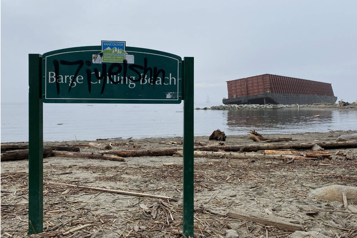 Vancouver’s temporary Barge Chilling Beach sign has twice been tagged with the Indigenous place name Í7iy̓el̓shn, pronounced ee-ay-ul-shun, which means “good underfoot” in hən̓q̓əmin̓əm. (Cole Schisler/Black Press)