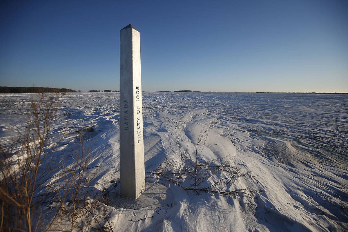 A border marker is shown just outside of Emerson, Man. on Thursday, January 20, 2022. American investigators believe the deaths of four people, including a baby and a teen, whose bodies were found in Manitoba near the United States border are linked to a larger human smuggling operation. THE CANADIAN PRESS/John Woods