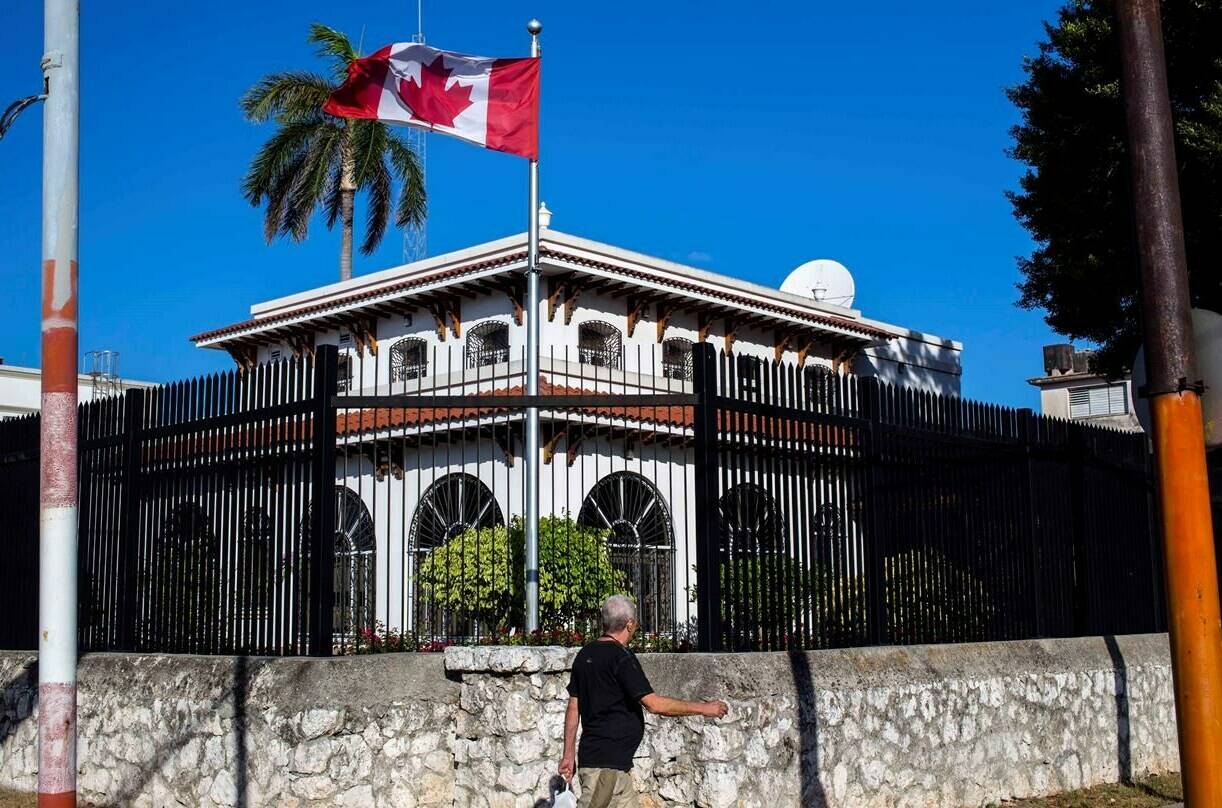 A man walks beside Canada’s embassy in Havana, Cuba, Tuesday, April 17, 2018.	THE CANADIAN PRESS/AP-Desmond Boylan