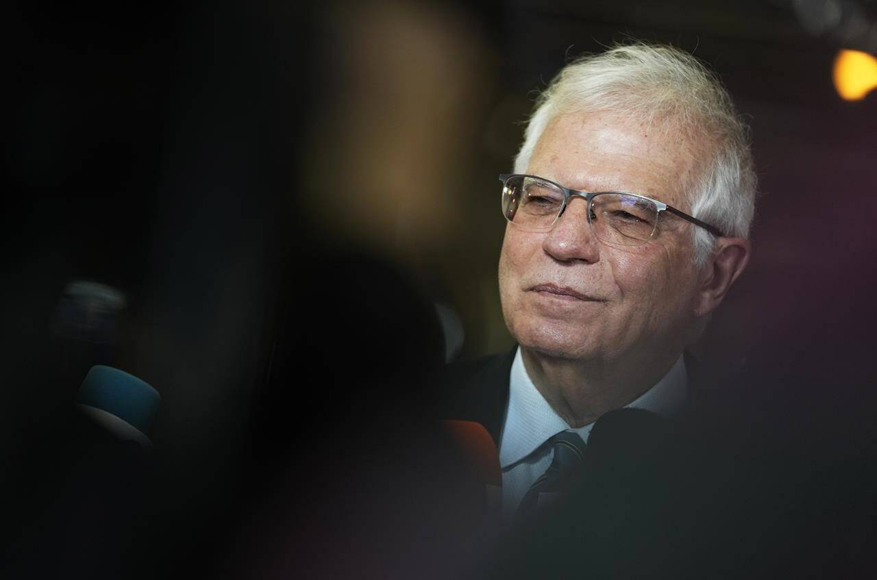 European Union foreign policy chief Josep Borrell speaks with the media as he arrives for a meeting of EU foreign ministers at the European Council building in Brussels, Monday, Jan. 24, 2022. European Union foreign ministers are aiming Monday to show a fresh display of resolve and unity in support of Ukraine, amid deep uncertainty about whether President Vladimir Putin intends to attack Russia’s neighbor or send his troops across the border. (AP Photo/Virginia Mayo)