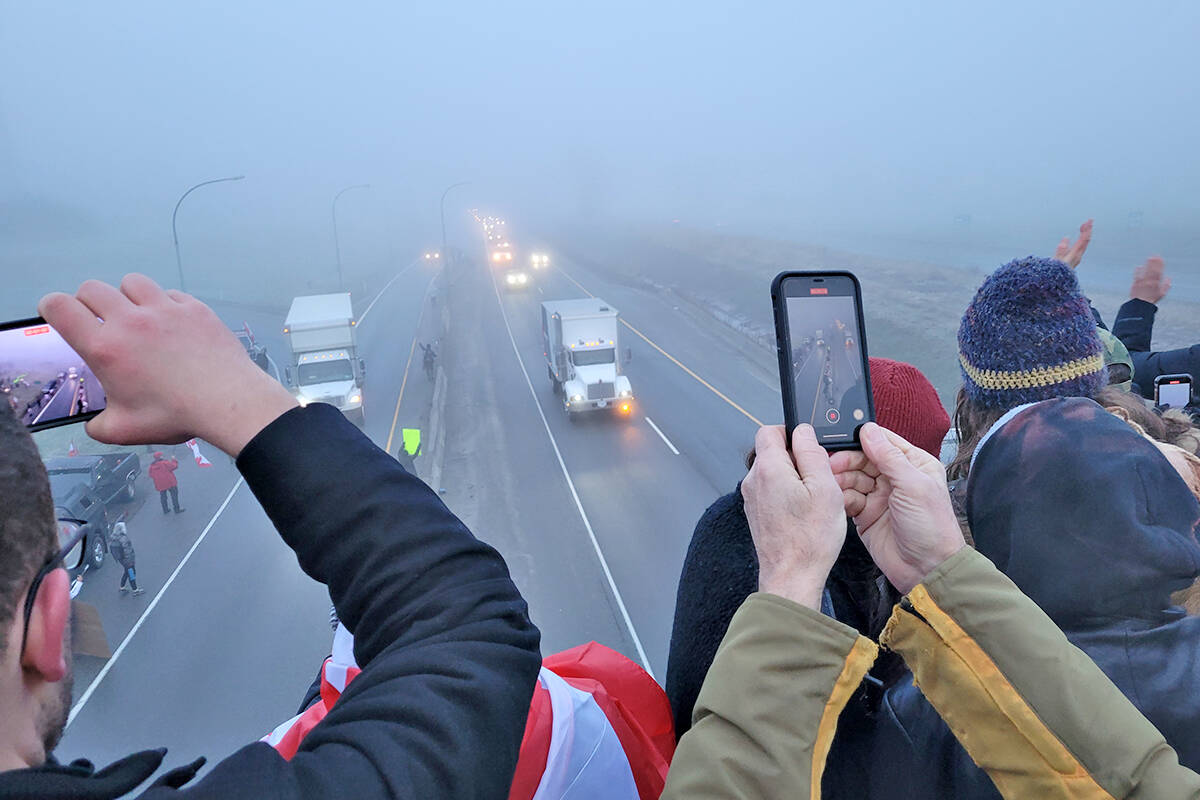 Supporters cheered on a procession of trucks on Sunday morning, Jan. 23, as they passed through Langley en route to Ottawa to protest a requirement that cross-border drivers must be vaccinated or quarantine for 14 days.. (Dan Ferguson/Langley Advance Times)