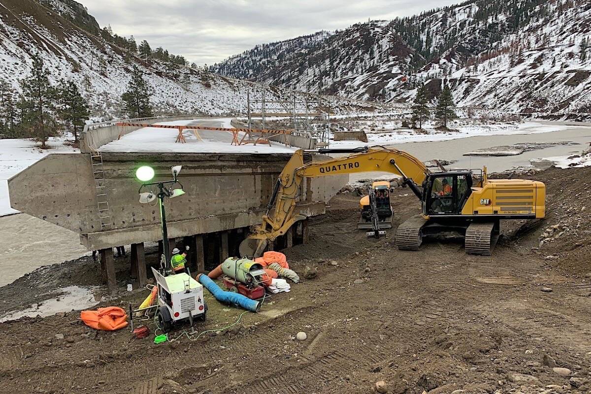 Work continues at 3 Mile Bridge on B.C. Highway 8, which was washed out or damaged in 23 places in record rain and flooding mid-November 2021. (B.C. transportation ministry photo)