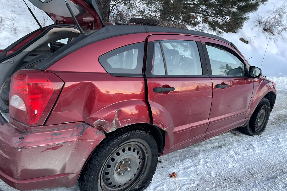 Midway RCMP arrested three suspects who allegedly fled police in Oliver in this late-model Dodge Caliber. One of the suspects allegedly backed the car into a police cruiser, denting the Dodge’s rear passenger quarter-panel. Photo: Submitted