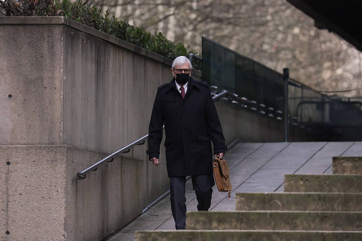 Craig James, former clerk of the British Columbia legislature, leaves B.C. Supreme Court during a break from his trial in Vancouver, on Wednesday, January 26, 2022. James has pleaded not guilty to two counts of fraud over $5,000 and three counts of breach of trust by a public officer. THE CANADIAN PRESS/Darryl Dyck