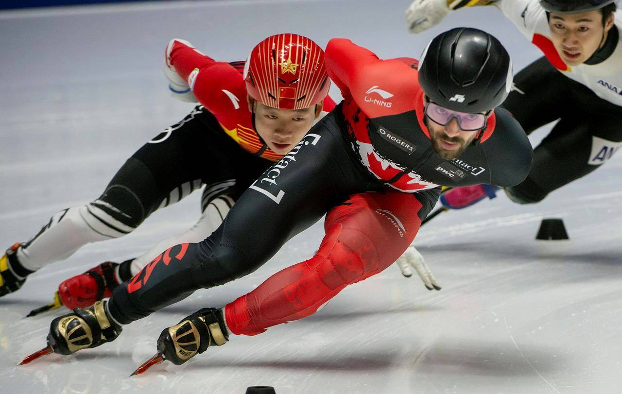 Canada’s Charles Hamelin, in front, competes in the quarterfinals of the 1000-metre short track speed skating championships in Montreal, Sunday, Jan. 12, 2020. THE CANADIAN PRESS/Peter McCabe