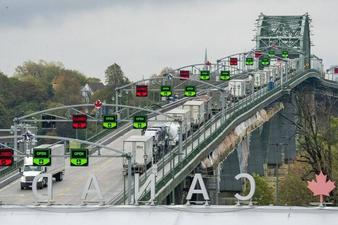 Trucks line up on the Peace Bridge in Fort Erie, Ont. as they enter the United States on Wednesday Oct. 21, 2020. THE CANADIAN PRESS/Frank Gunn