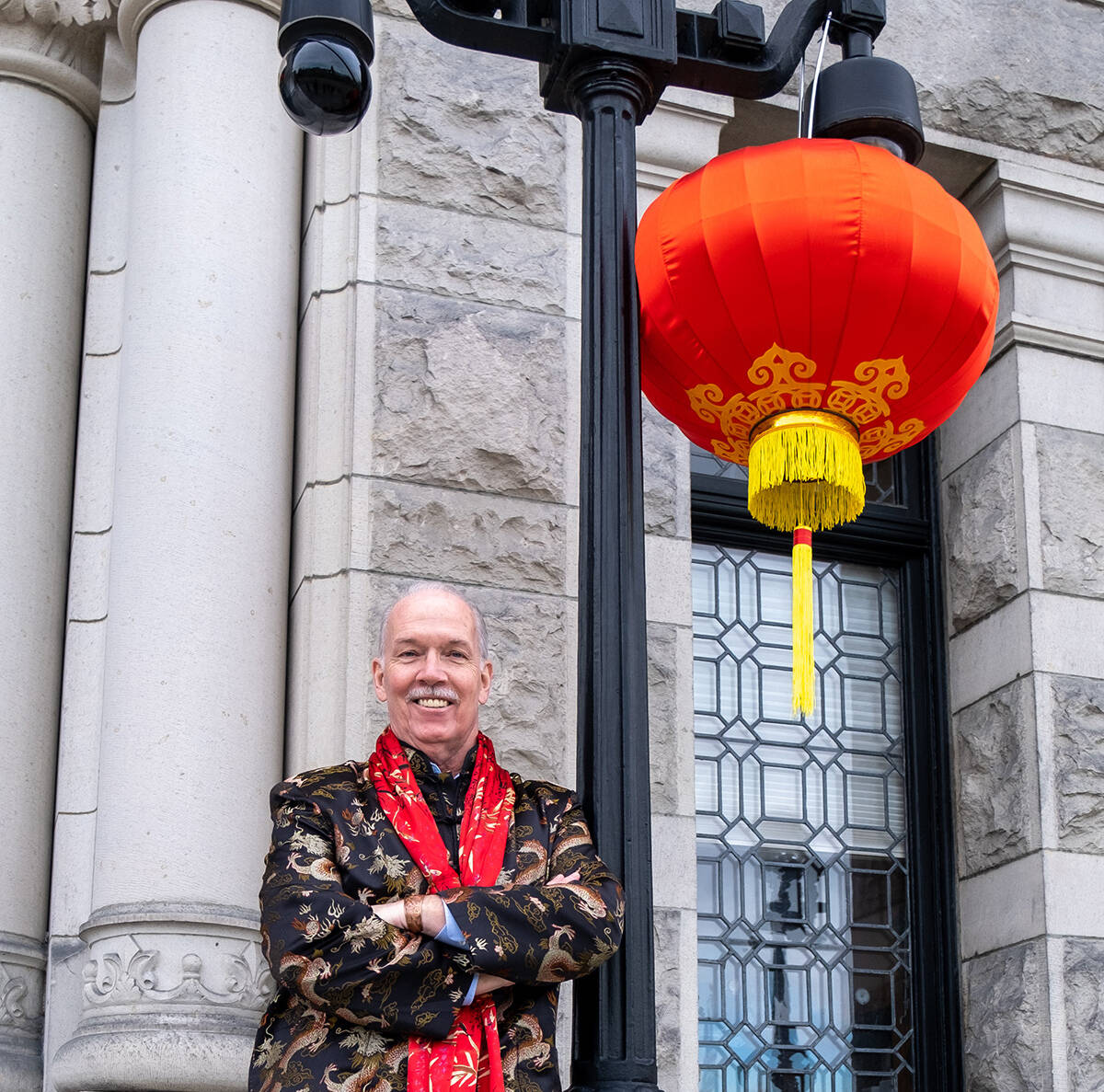 Premier John Horgan makes his first public appearance since completing cancer treatment for Lunar New Year at the B.C. legislature on Tuesday, Feb. 1, 2022. (John Horgan/Twitter)