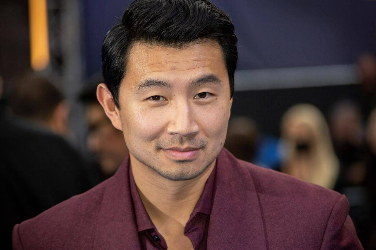 Actor Simu Liu poses for photographs on the red carpet for the premiere of ‘Shang-Chi and the Legend of the Ten Rings’, at a cinema in west London, Thursday, Aug 26, 2021. THE CANADIAN PRESS/AP-Photo by Joel C Ryan/Invision/AP