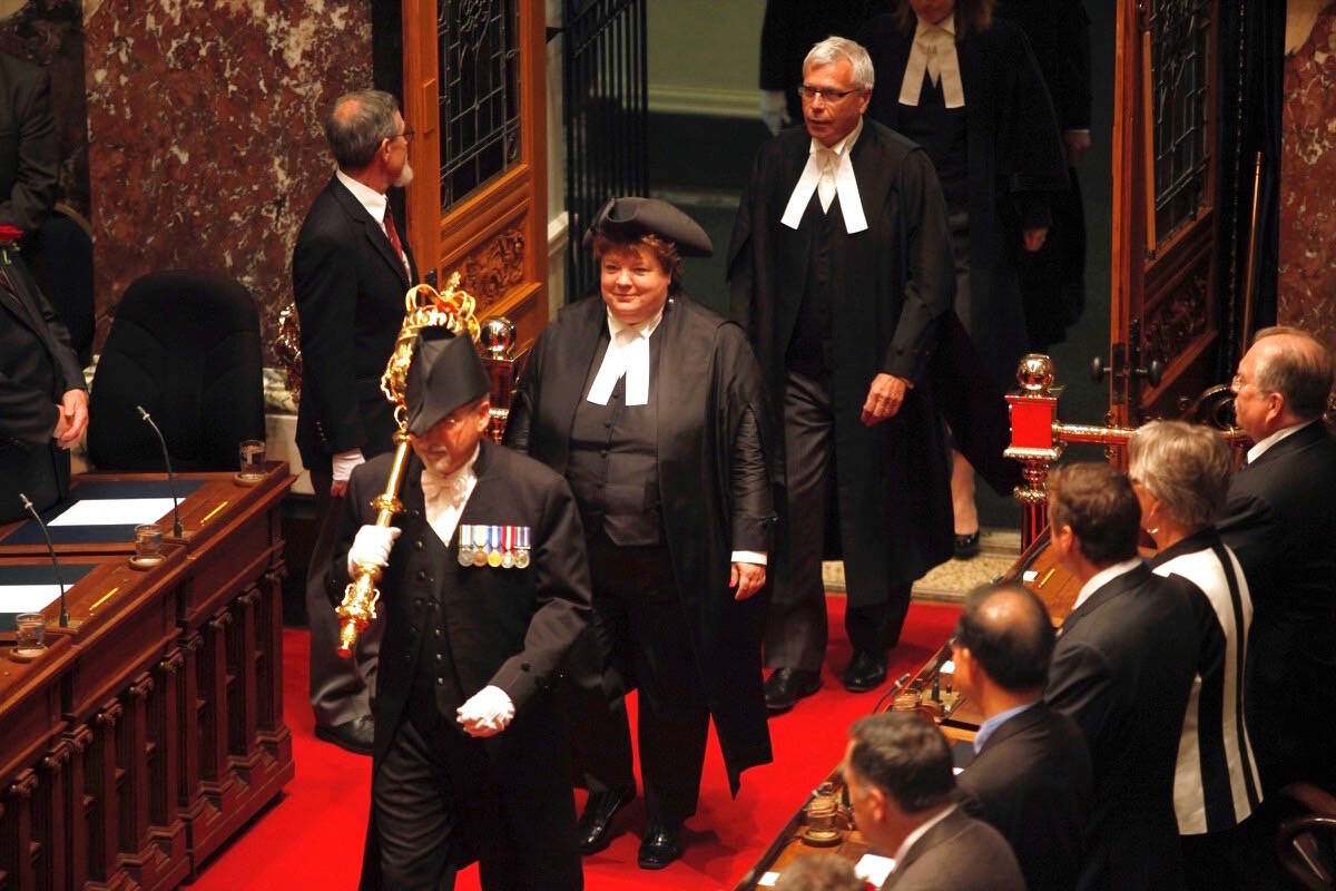 Speaker Linda Reid enters B.C. legislature chamber for throne speech, led by former sergeant-at-arms Gary Lenz and followed by legislature clerk Craig James, June 26, 2013. (Chad Hipolito/The Canadian Press)