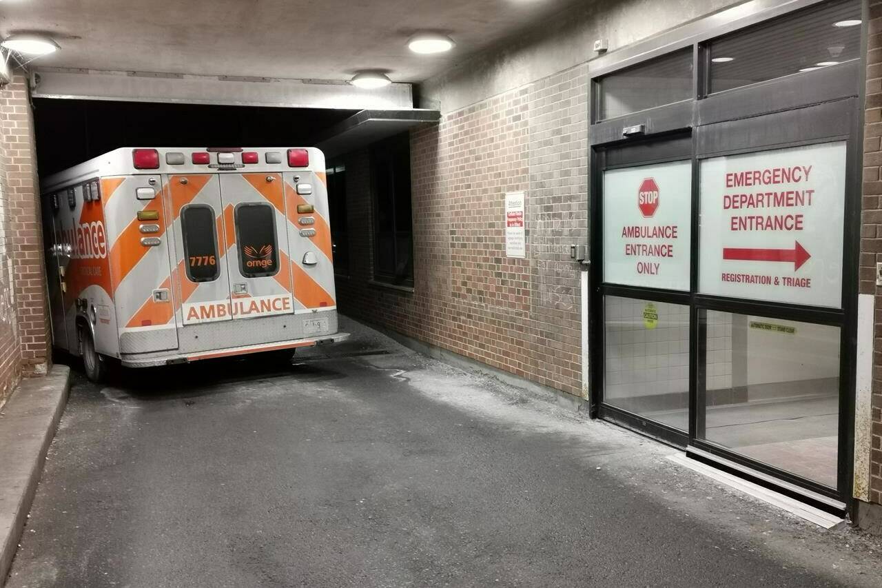 An ambulance is parked at the emergency department at the Lakeridge Health hospital in Bowmanville, Ont. on Wednesday January 12, 2022. THE CANADIAN PRESS/Doug Ives