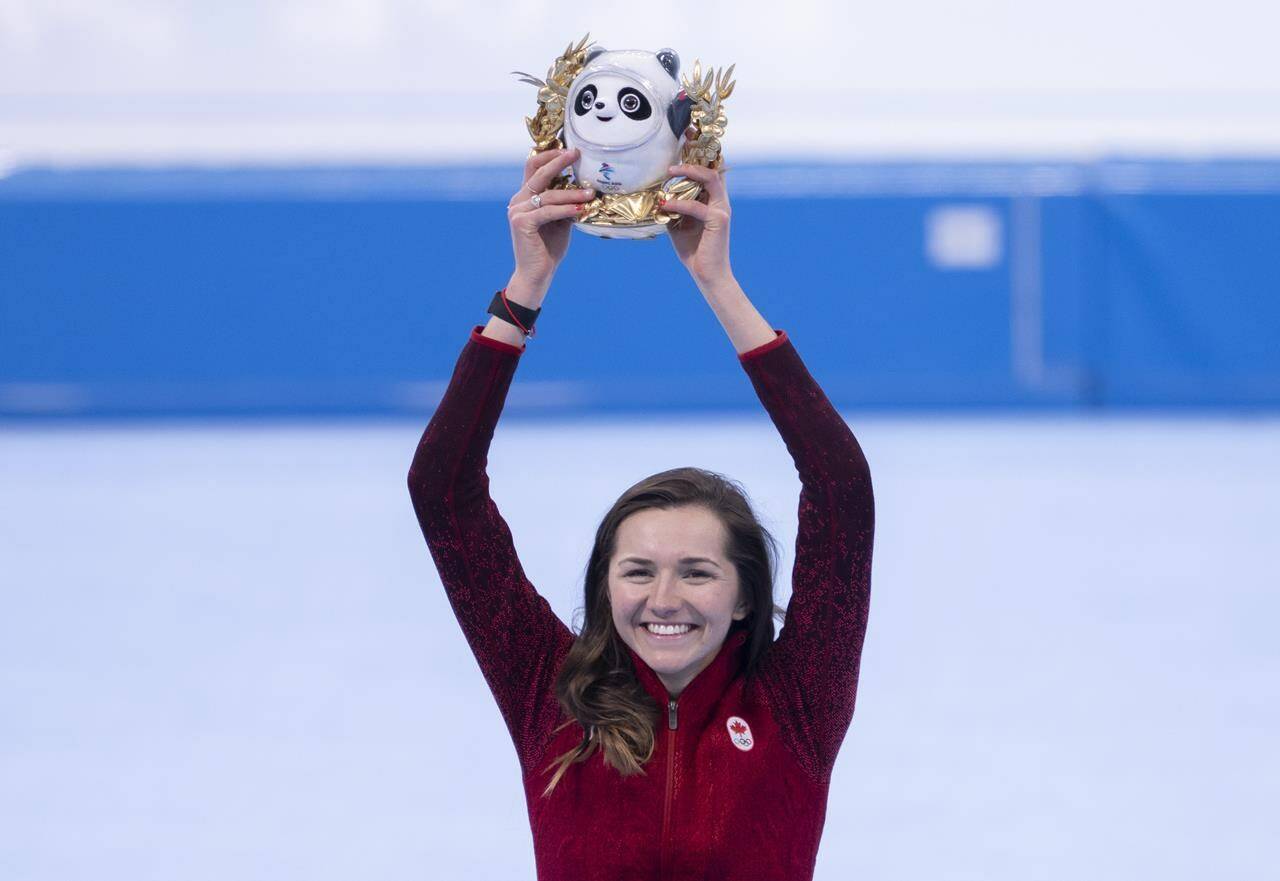 Isabelle Weidemann, of Canada, smiles from the podium after winning the bronze medal in the women’s 3,000 metre speedskating race at the 2022 Winter Olympics in Beijing on Saturday, February 5, 2022. THE CANADIAN PRESS/Paul Chiasson