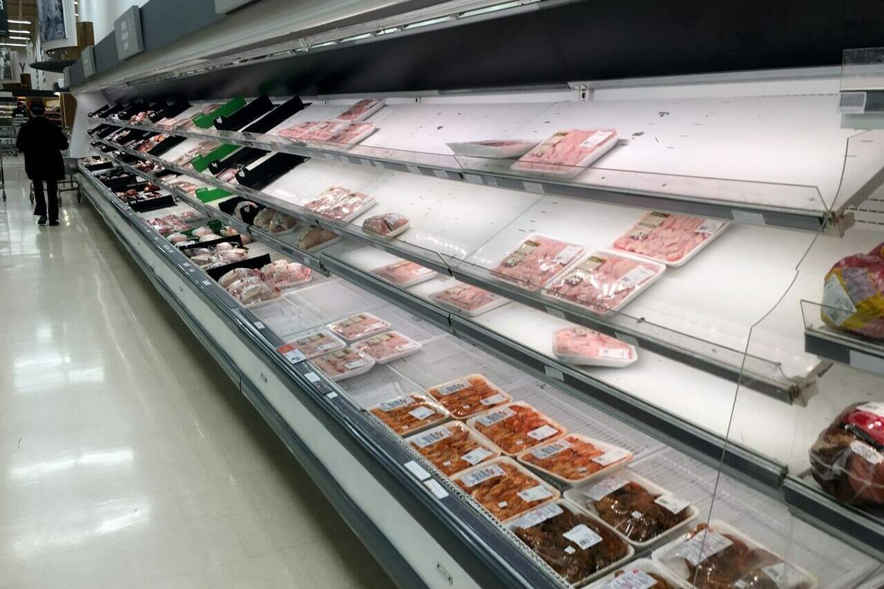 Grocery store shelves await restocking early in the morning in Toronto on Friday March 13, 2020. THE CANADIAN PRESS/Frank Gunn
