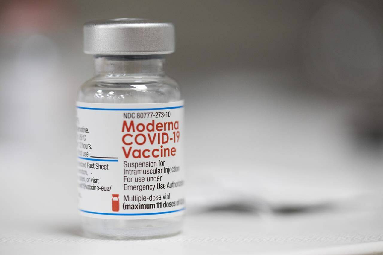 FILE – A vial of the Moderna COVID-19 vaccine is displayed on a counter at a pharmacy in Portland, Ore., Monday, Dec. 27, 2021. (AP Photo/Jenny Kane)