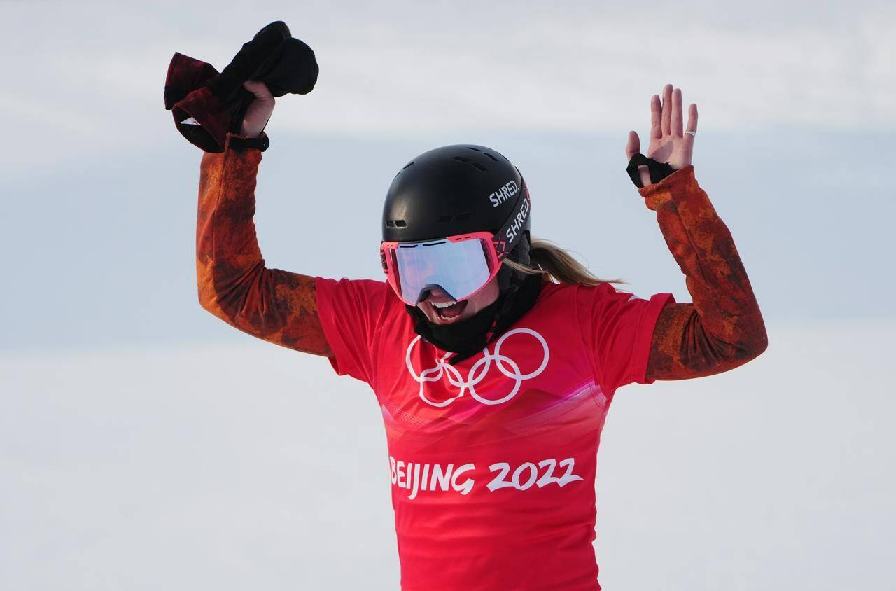 Canada’s Meryeta Odine celebrates her bronze medal in the women’s snowboard cross final at the 2022 Beijing Winter Olympics in Zhangjiakou, China on Wednesday, Feb. 9, 2022. THE CANADIAN PRESS/Sean Kilpatrick