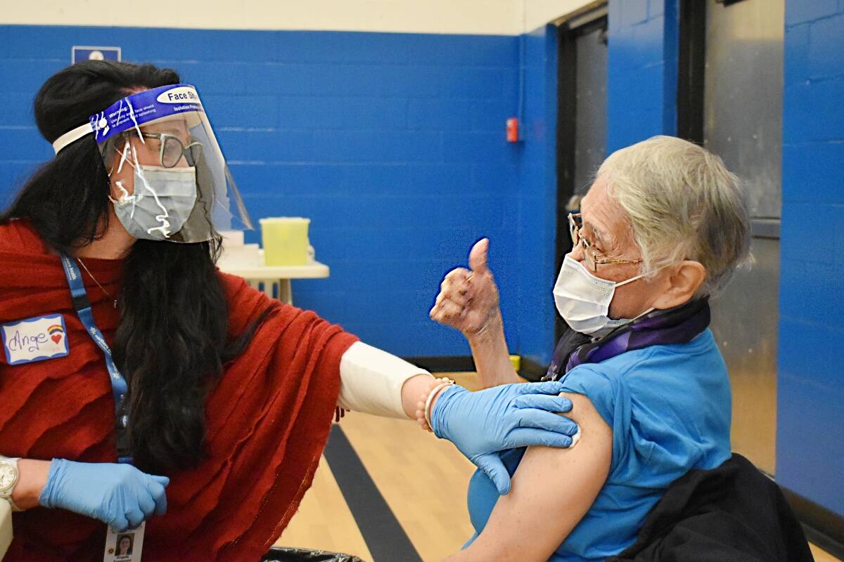 The BC Nurses Union is calling on MLAs for support to address the staffing crisis and violence against staff. Nurse Angie Z. gets a thumbs up from Delores Campbell at the Prince Rupert community vaccination clinic in March 2021. (Photo: K-J Millar/The Northern View.
