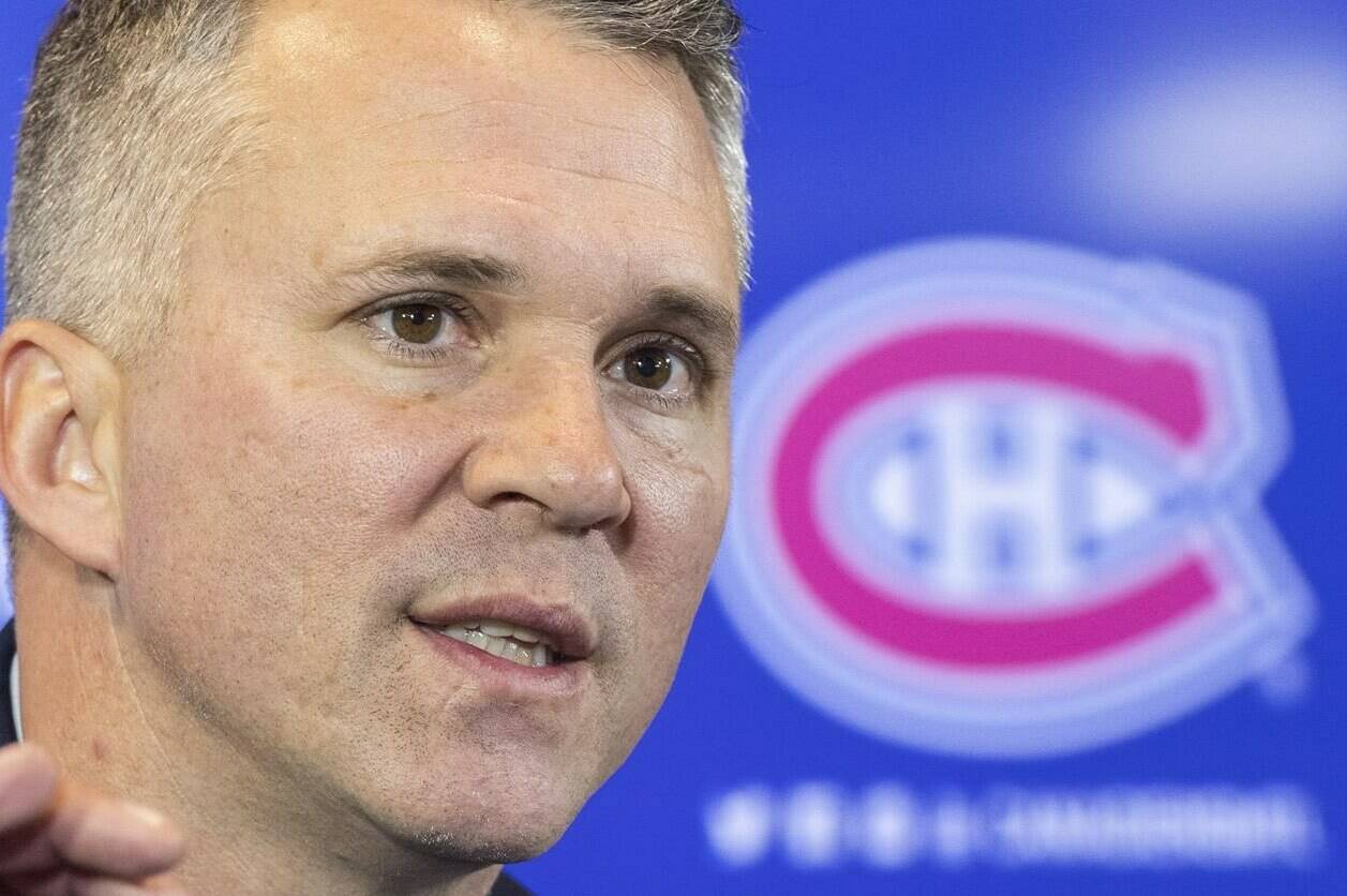 New Montreal Canadiens interim head coach Martin St. Louis speaks to the media alongside in Brossard, Que., Thursday, Feb. 10, 2022. In his introductory press conference Thursday morning, the Stanley Cup champion admitted that becoming a head coach was something he was preparing for a decade. THE CANADIAN PRESS/Graham Hughes