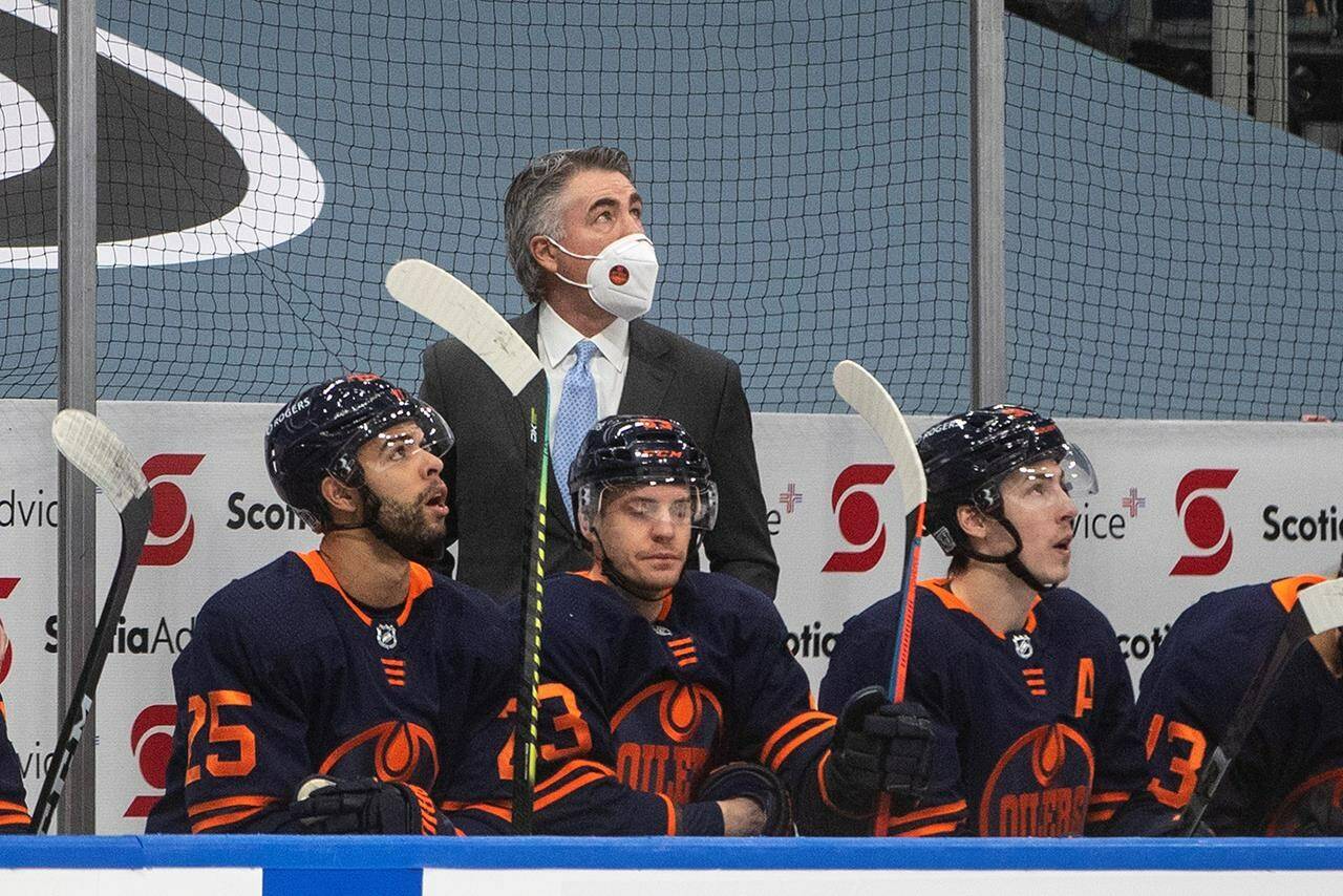 Edmonton Oilers’ head coach Dave Tippett is honoured for his 600th win while taking on the Calgary Flames during first period NHL action in Edmonton on Saturday, February 20, 2021. THE CANADIAN PRESS/Jason Franson