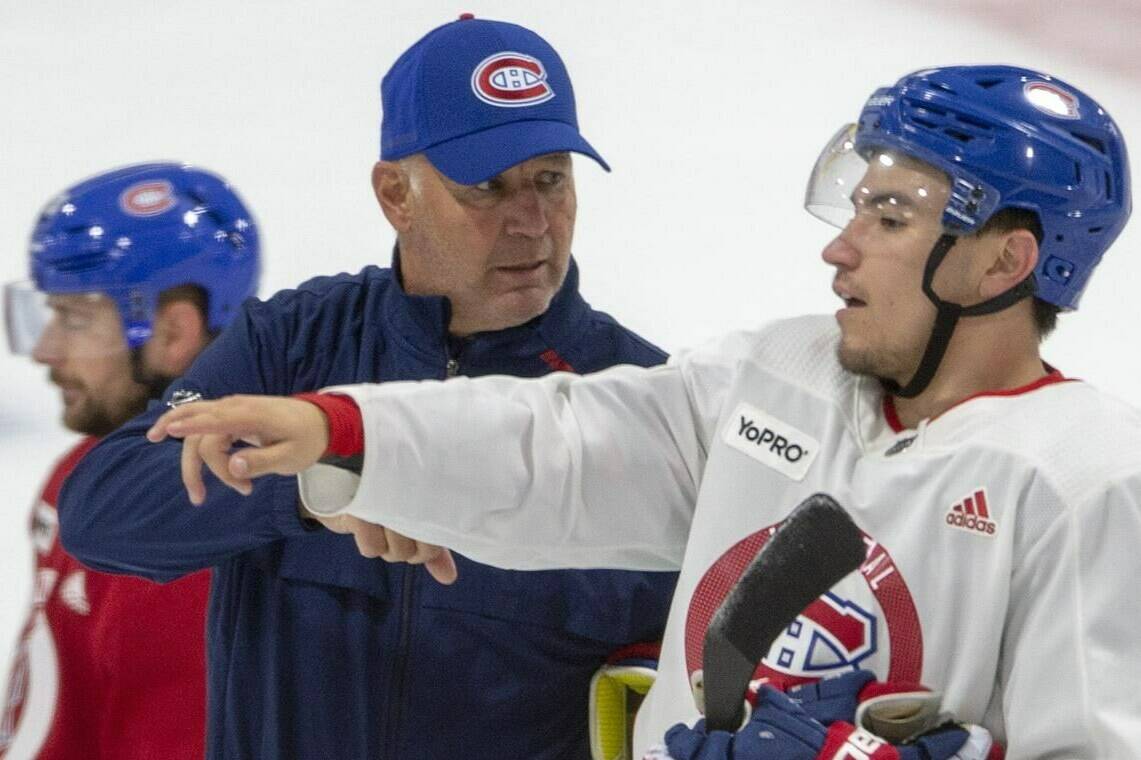 FILE PHOTO - Then-Montreal Canadiens head coach Claude Julien, goes over a drill with forward Nick Suzuki during practice Friday, July 17, 2020 in Brossard, Que. THE CANADIAN PRESS/Ryan Remiorz