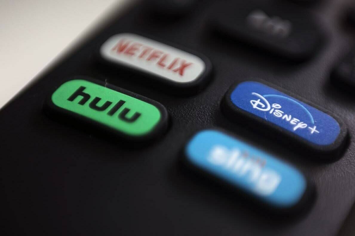 The logos for several streaming services are pictured on a remote control in Portland, Ore., Aug. 13, 2020. Experts are raising concerns that the body the government wants to regulate the way people watch video content in Canada. THE CANADIAN PRESS/AP-Jenny Kane-File