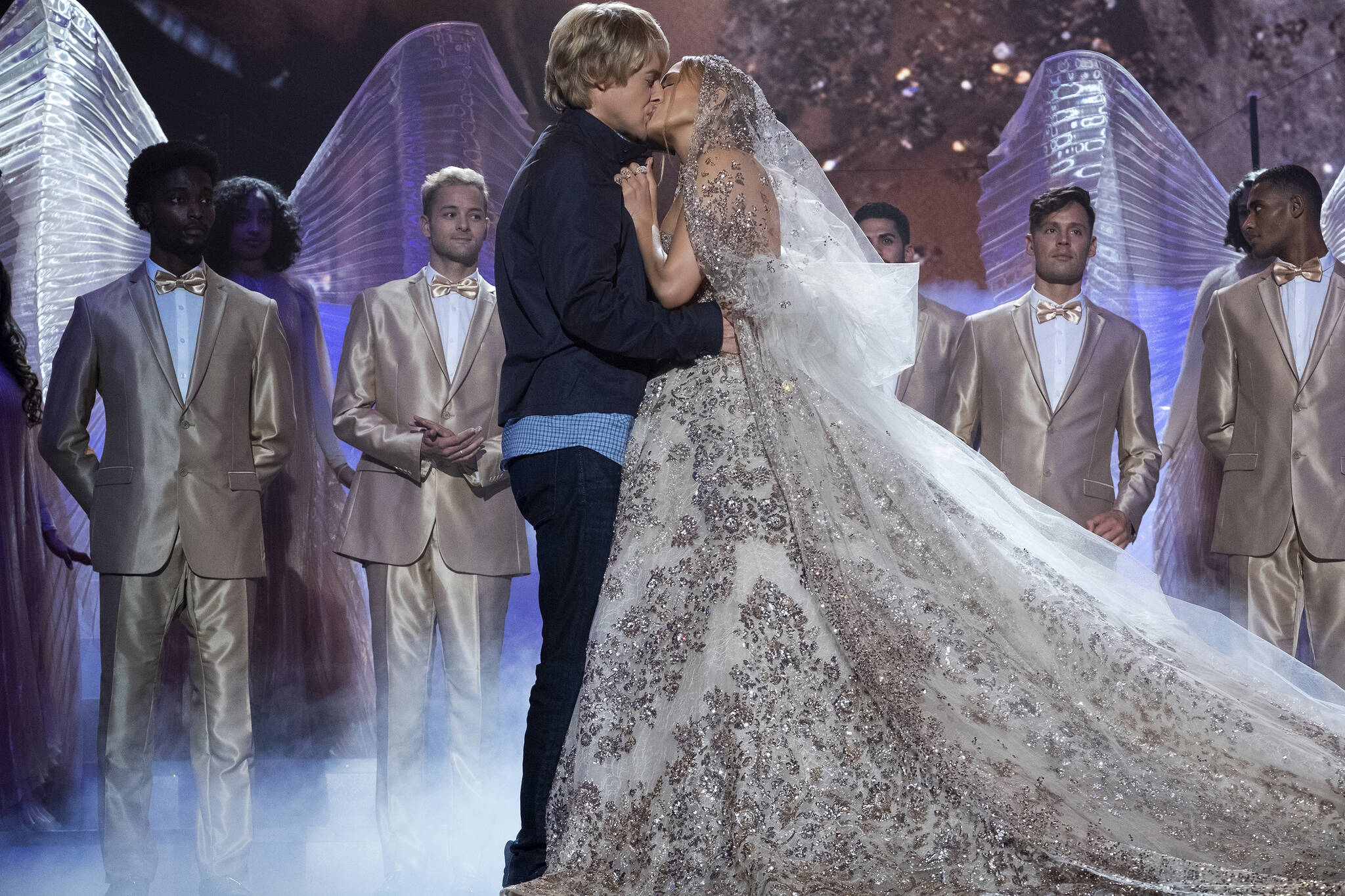 This image released by Universal Pictures shows Jennifer Lopez, right, and Owen Wilson in a scene from “Marry Me.” (Barry Wetcher/Universal Pictures via AP)