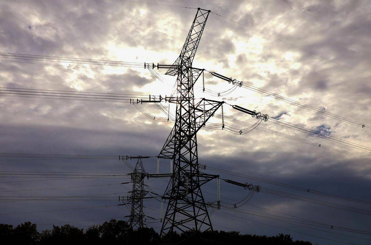 Electrical transmission lines are seen south of Chesley, Ont., on Sunday, Sept. 29, 2019. The Alberta Utilities Commission is negotiating a settlement with ATCO Electric tied to an alleged breach of regulations. THE CANADIAN PRESS/Colin Perkel