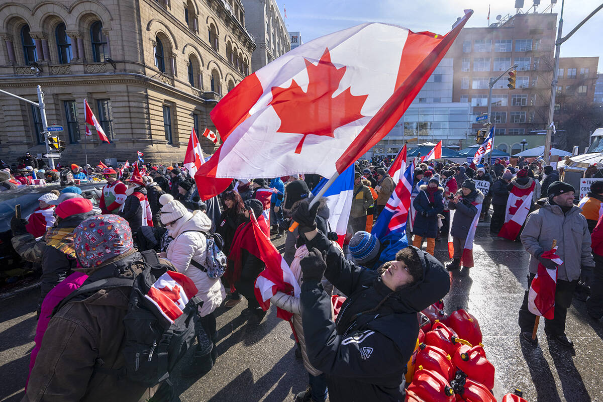 People gather for an anti-mandate protest on Parliament Hill in Ottawa on Sunday, February 13, 2022. THE CANADIAN PRESS/Frank Gunn