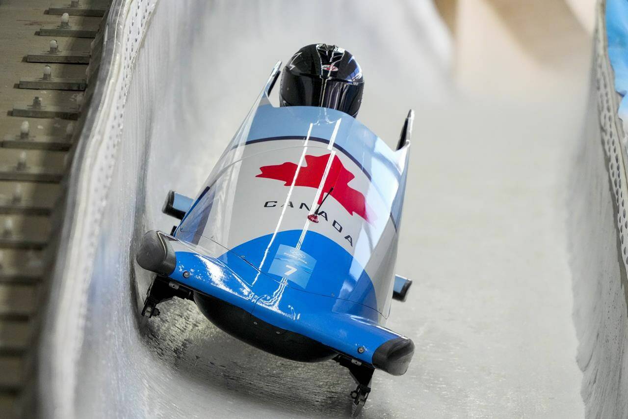 Christine De Bruin, of Canada, drives during the women’s monobob heat 3 at the 2022 Winter Olympics, Monday, Feb. 14, 2022, in the Yanqing district of Beijing. THE CANADIAN PRESS/AP-Dmitri Lovetsky
