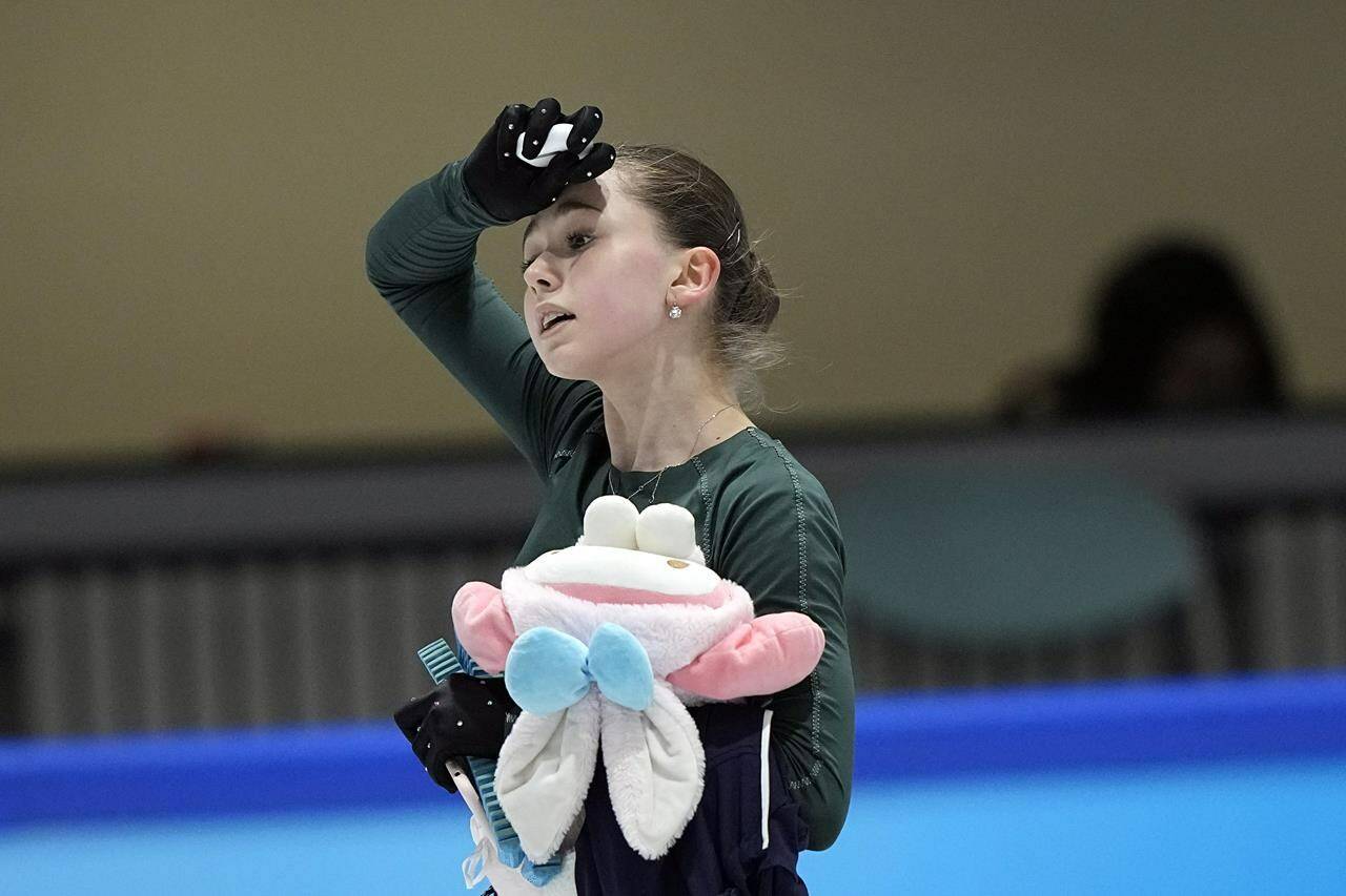 Kamila Valieva, of the Russian Olympic Committee, leaves the ice after a training session at the 2022 Winter Olympics, Sunday, Feb. 13, 2022, in Beijing. (AP Photo/David J. Phillip)