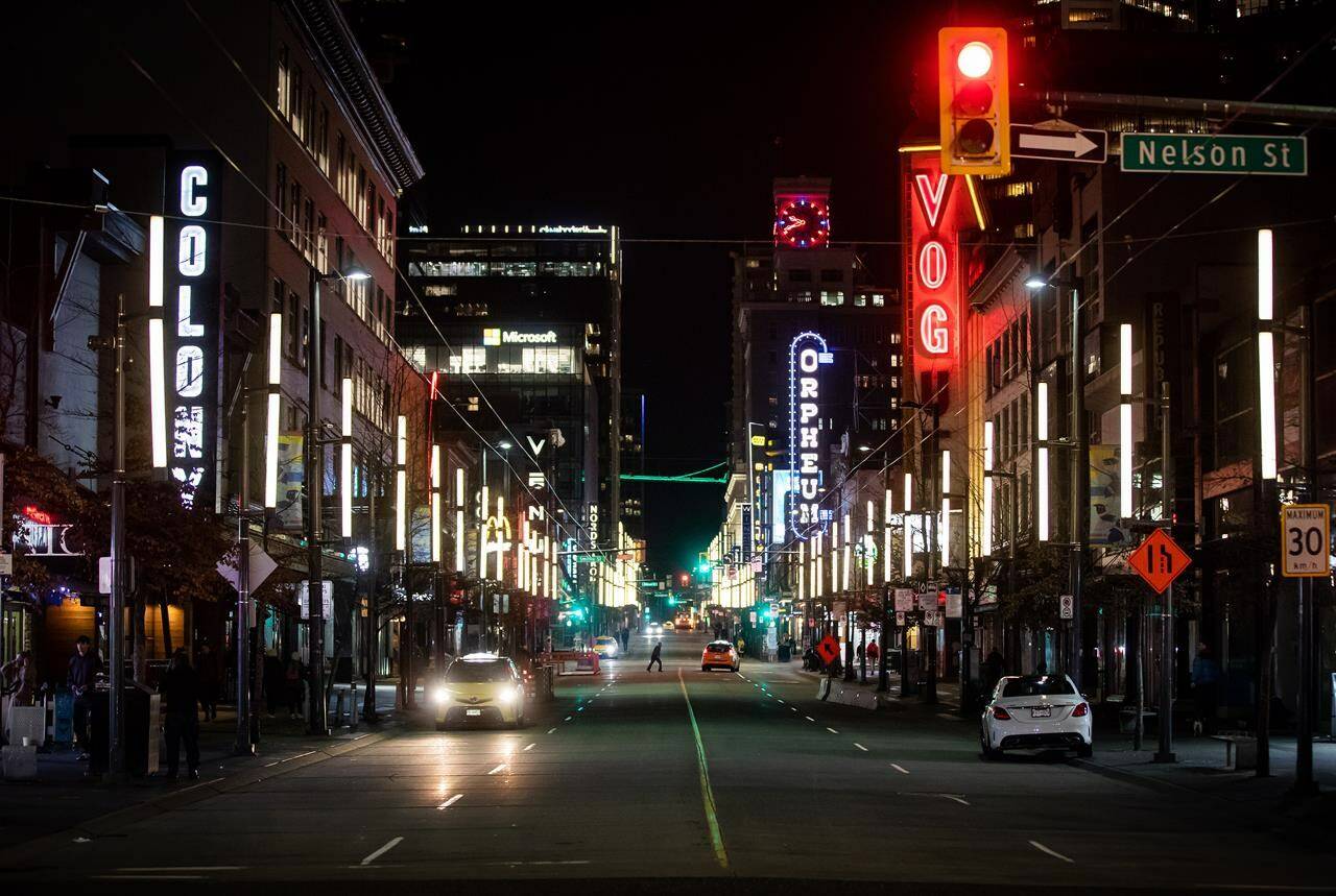FILE – A nearly empty Granville Street entertainment district is seen just before 10 p.m. on St. Patrick’s Day in downtown Vancouver, on Wednesday, March 17, 2021. THE CANADIAN PRESS/Darryl Dyck
