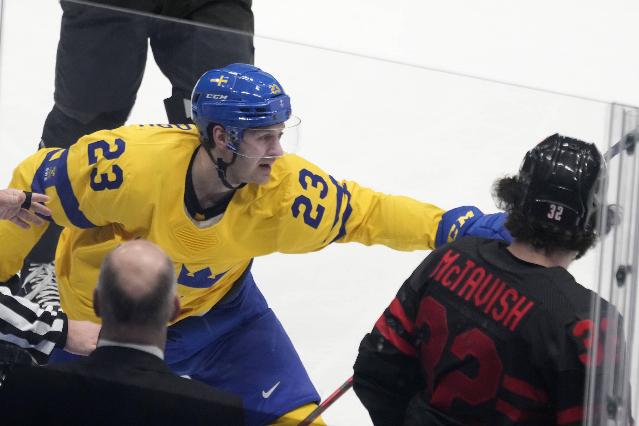 Team Sweden forward Lucas Wallmark (23) celebrates after scoring as Team Canada forward Mason McTavish (32) looks on during third period men’s quarter-final hockey action at the Beijing Winter Olympics in Beijing, China, on Wednesday, Feb. 16, 2022. THE CANADIAN PRESS/Ryan Remiorz