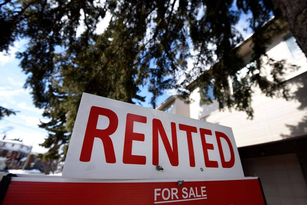 A sign outside a home indicates that it has been rented, in Ottawa, on Monday, March 1, 2021. THE CANADIAN PRESS/Justin Tang