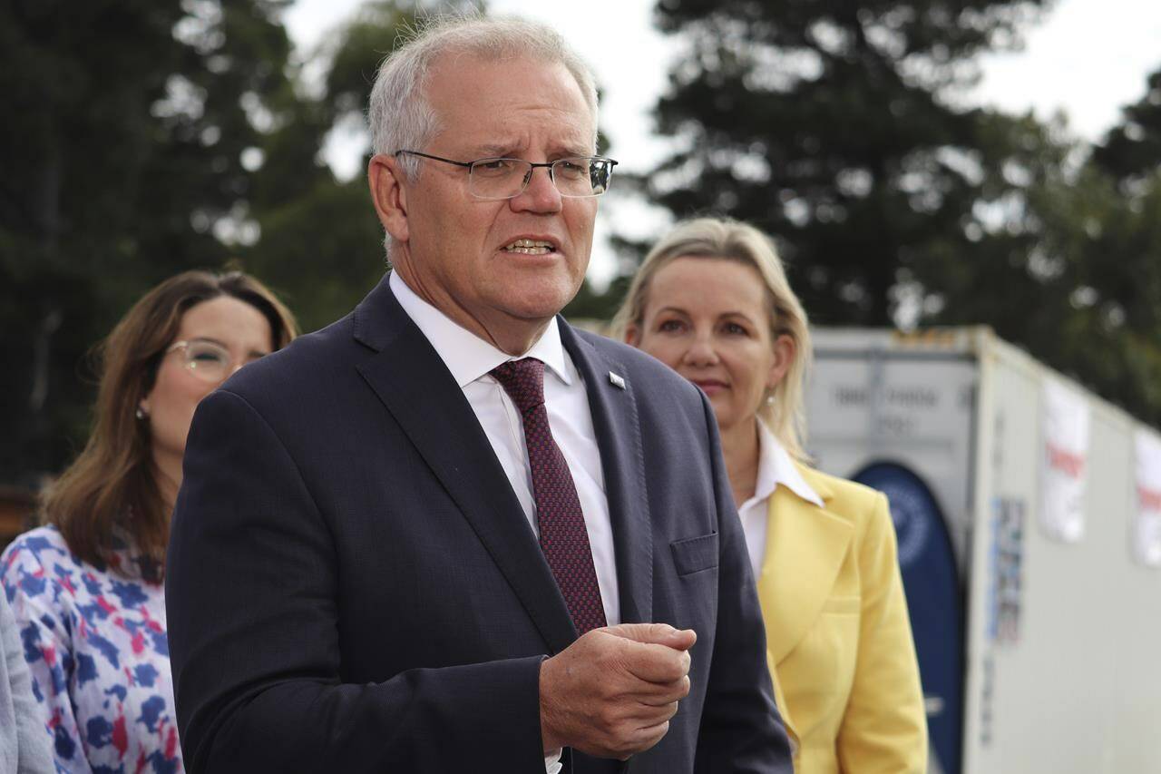 Australian Prime Minister Scott Morrison speaks to the media during a visit to Elphinstone Engineering in Triabunna, Tasmania, Tuesday, Feb. 22, 2022. World leaders scrambled Tuesday to condemn Russian President Vladimir Putin — and to signal possible sanctions — after he ordered his forces into separatist regions of eastern Ukraine. Prime Minister Morrison said Russia should “unconditionally withdraw” from Ukrainian territory and stop threatening its neighbors. (Ethan James/AAP Image via AP)
