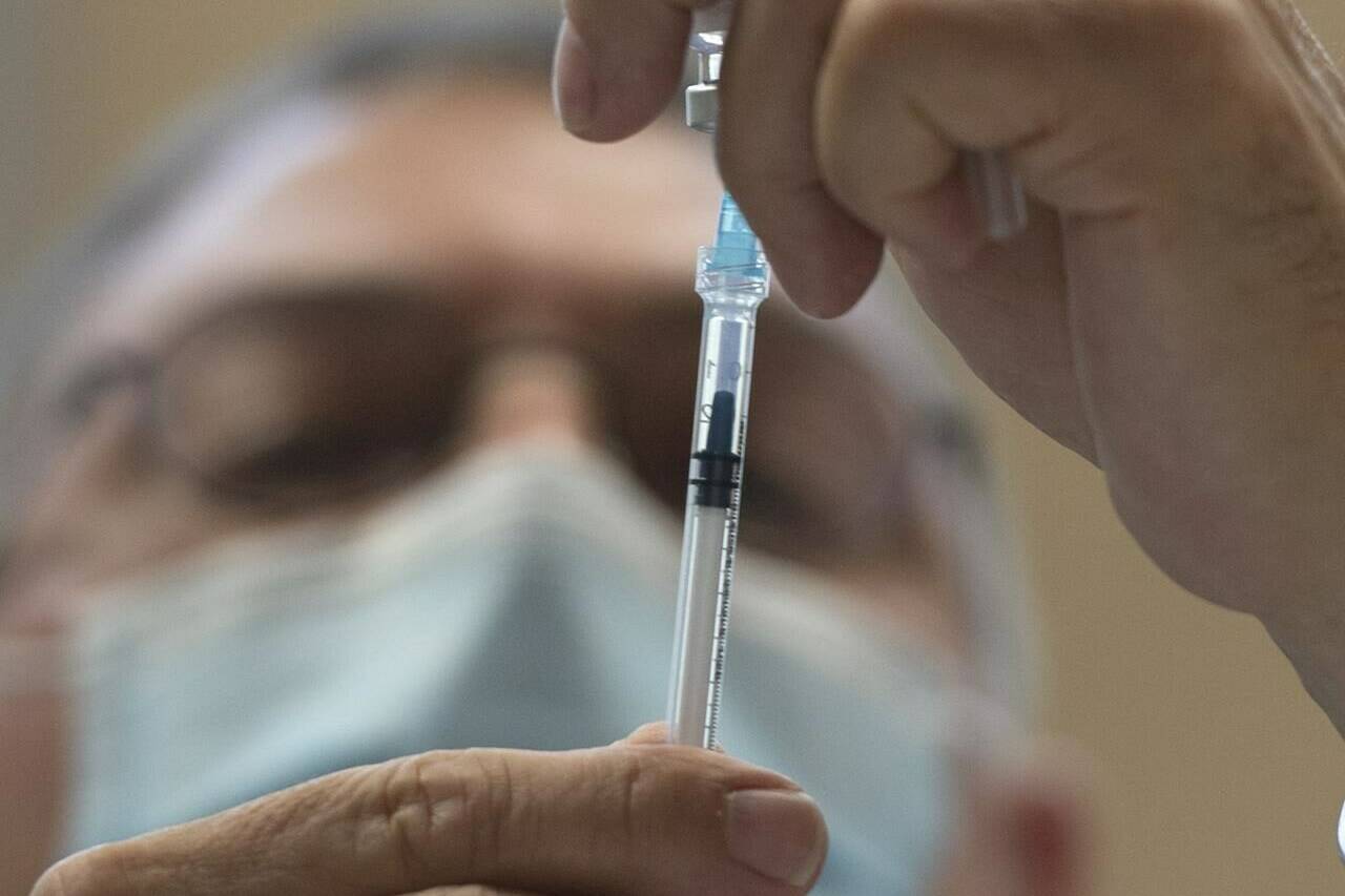 A Pfizer-BioNTech COVID-19 vaccine dose is prepared at a mobile clinic in Montreal on Friday, April 30, 2021. THE CANADIAN PRESS/Ryan Remiorz