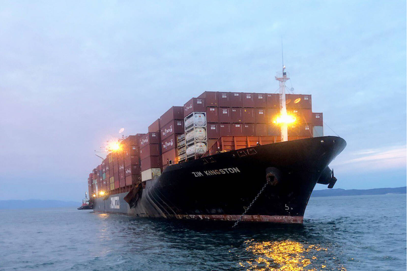 Container ship MV Kingston was escorted from its anchorage off Victoria to Duke Point in Nanaimo following the loss of several containers and an on-board fire last fall. (Photo: Transport Canada)