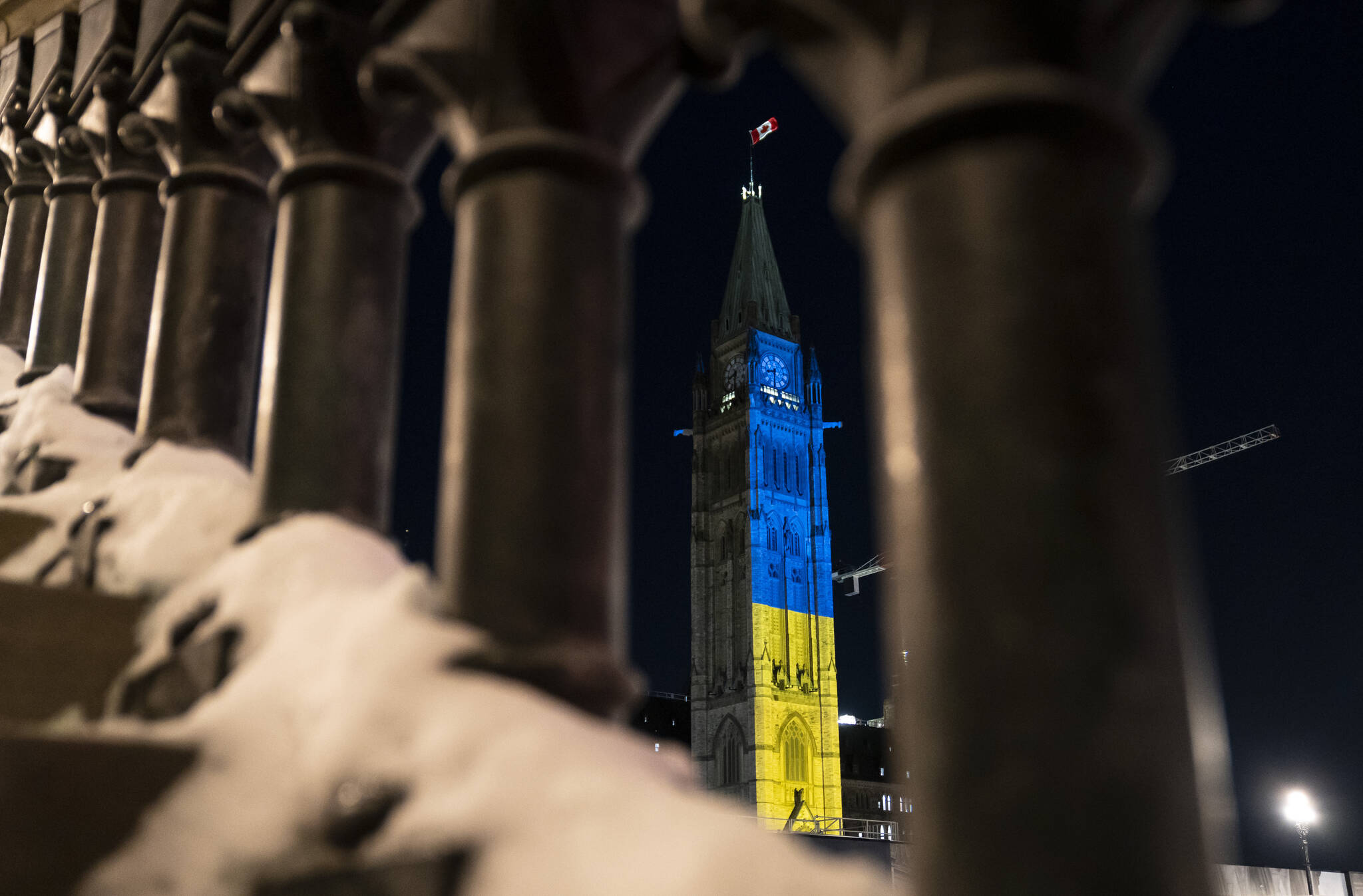 The Peace Tower on Parliament Hill is lit up with the colours of Ukraine’s national flag in a show of support following Russia’s invasion, in Ottawa, Sunday, Feb. 27, 2022. THE CANADIAN PRESS/Justin Tang