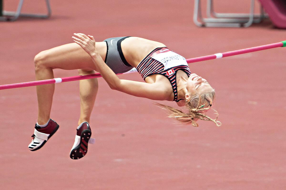 Georgia Ellenwood cleared the bar in the high jump event of the women’s heptathlon on Aug. 4, 2021 during competition at Olympic Stadium in Tokyo, Japan. On Friday, Feb. 25, during a qualifying meet for the world championships, she ruptured her Achilles tendon. (Daniel Lea/CSM)