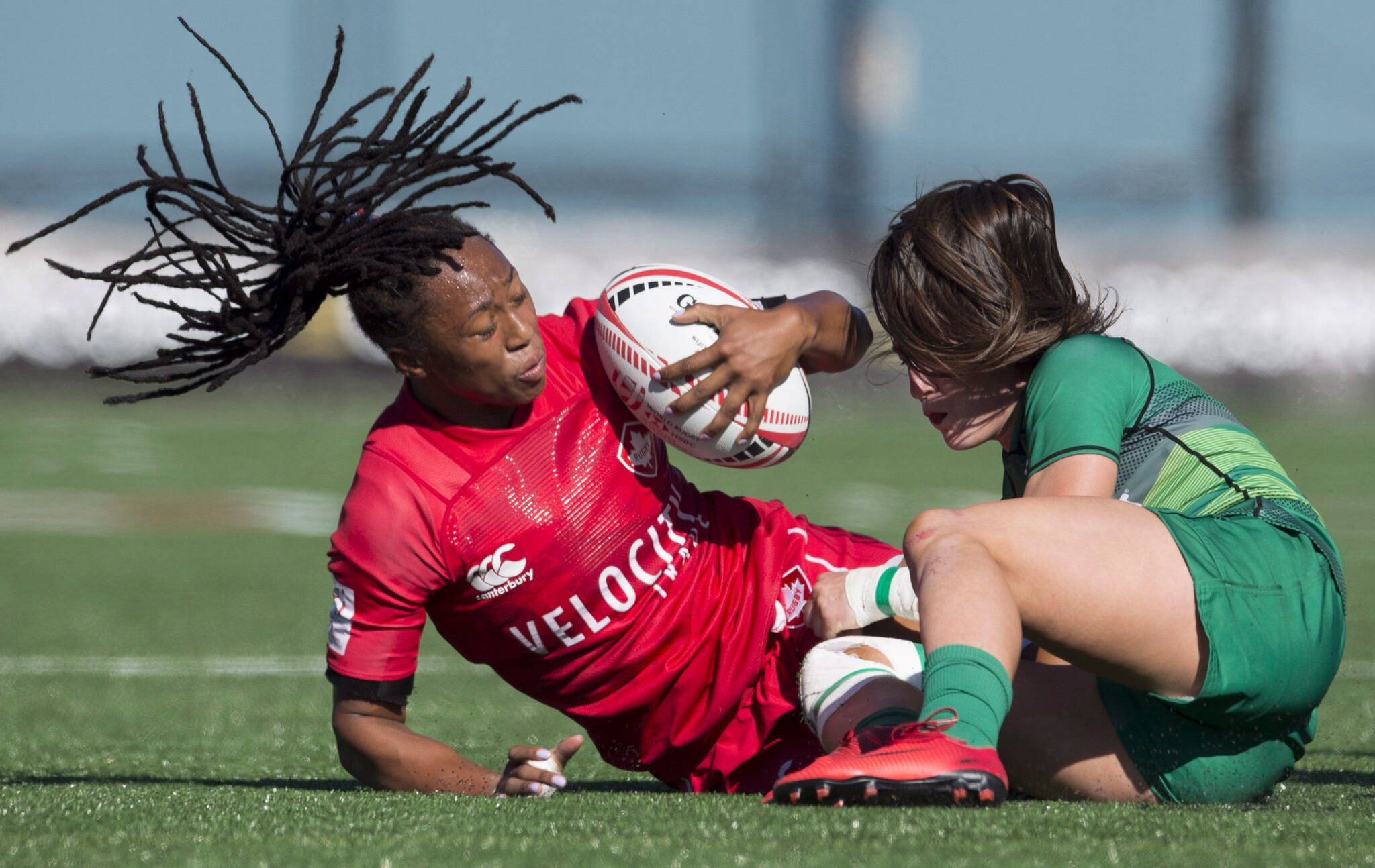 FILE — Canada’s Charity Williams (left) is tackled by Ireland’s Amee Leigh Murphy Crowe during the World Rugby Women’s Sevens Series in Langford, B.C., Saturday, May, 12, 2018. Canada’s bid for a women’s rugby sevens berth in the 2020 Tokyo Olympics came closer to reality Saturday with wins over Brazil and Ireland on home soil at Westhills Stadium. THE CANADIAN PRESS/Jonathan Hayward