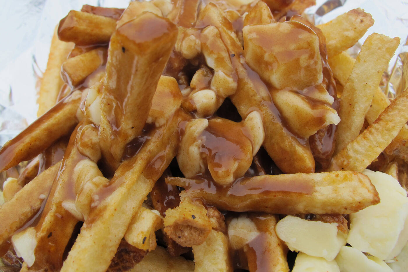 Quebec diner Le Roy Jucep announced last week on Facebook it was temporarily replacing the word “poutine” with “fries cheese gravy”. The founder of Le Roy Jucep is among those who claim to have created the fast-food staple. Photo by Crispin Semmens/used under common license