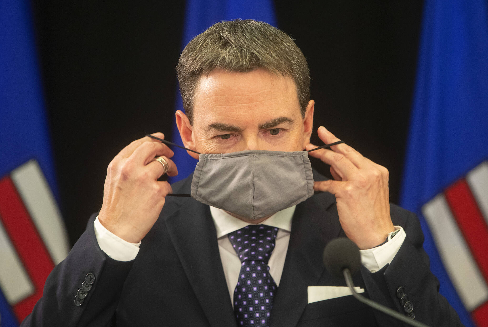 New Alberta Health Minister Jason Copping takes his mask off to give a COVID-19 update in Edmonton, Tuesday, Sept. 21, 2021. THE CANADIAN PRESS/Jason Franson