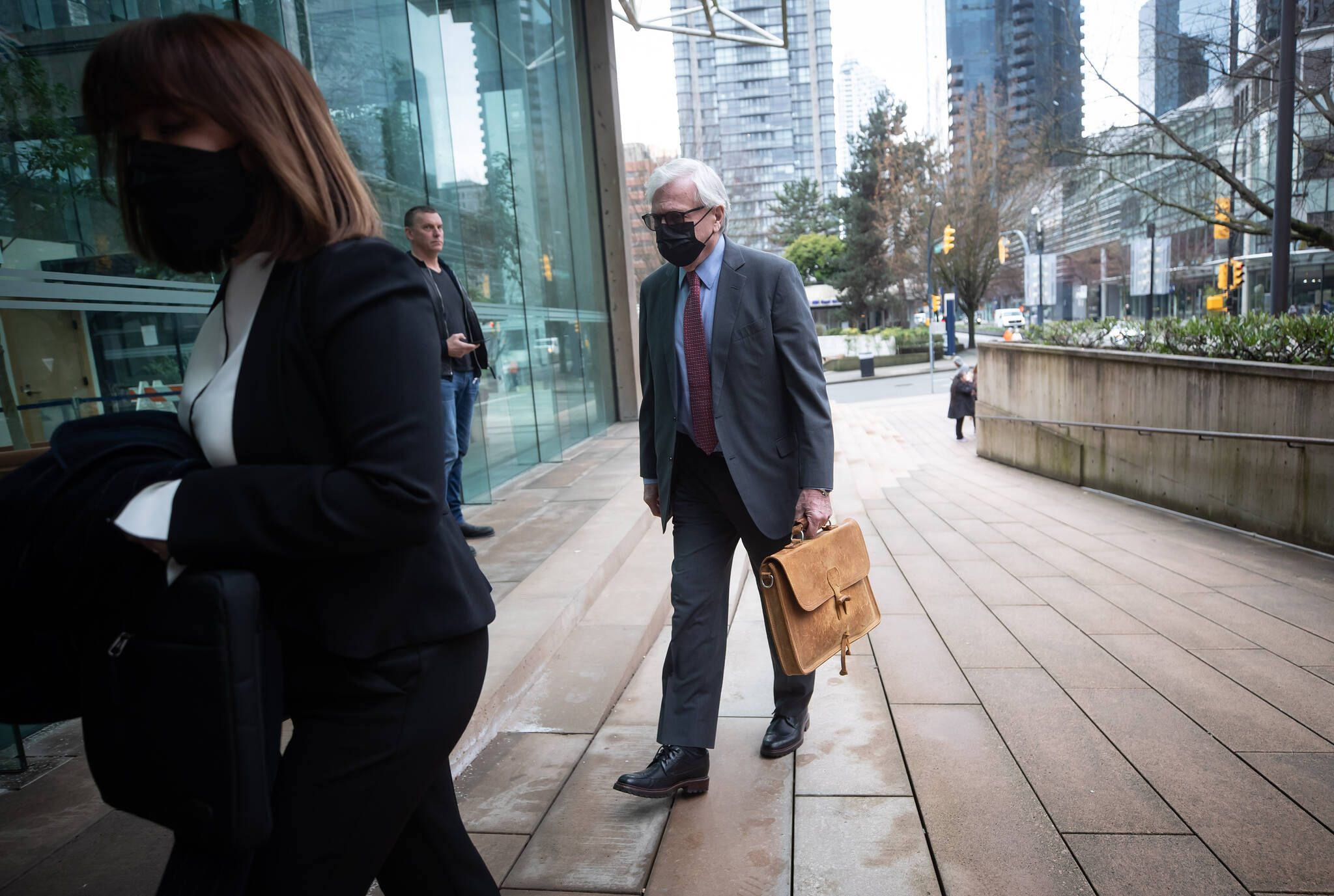 Craig James, former clerk of the B.C. legislative assembly, arrives back at B.C. Supreme Court after a break from his trial, in Vancouver, on Tuesday, March 1, 2022. A special prosecutor says British Columbia’s former clerk of the legislative assembly used public funds to enrich himself in “glaring and egregious” ways during closing arguments. James’s defence is expected to present its case Wednesday. THE CANADIAN PRESS/Darryl Dyck