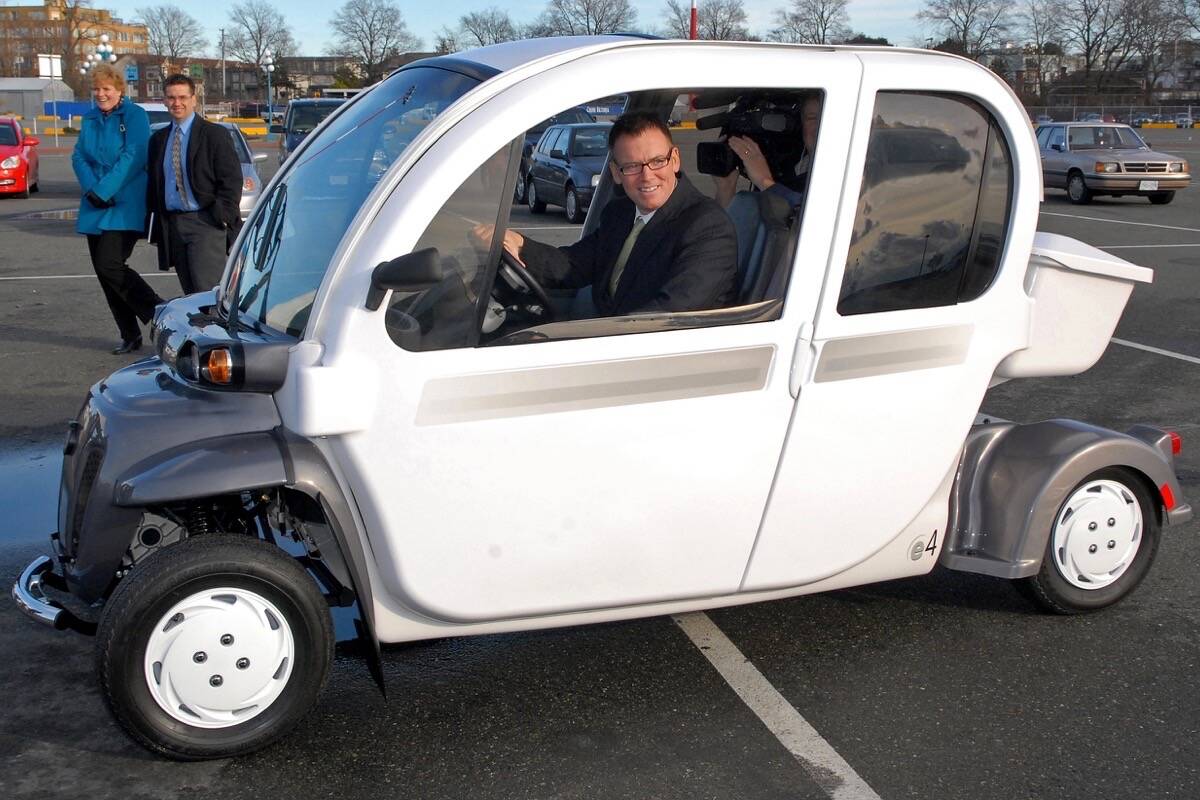 Kevin Falcon takes a spin in an early electric car at the B.C. Ferries Swartz Bay terminal in 2010, when he was transportation minister. After a decade away from politics, he returned as B.C. Liberal party leader in February. (Tom Fletcher/Black Press)
