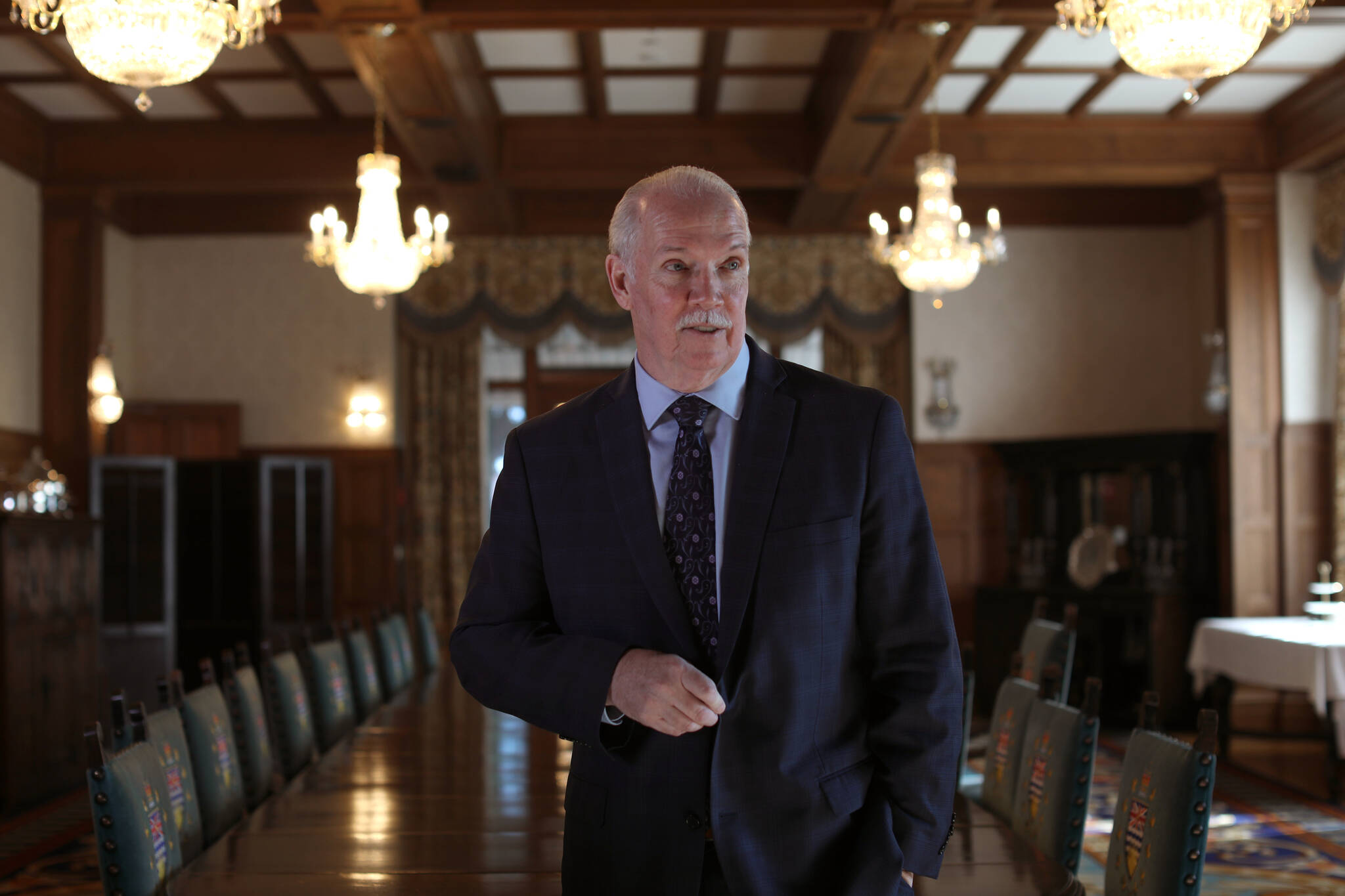 British Columbia Premier John Horgan poses for a portrait after a swearing-in ceremony at Government House in Victoria, Friday, Feb. 25, 2022. THE CANADIAN PRESS/Chad Hipolito