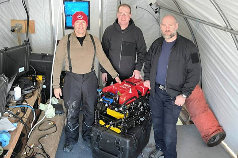 RCMP underwater recovery team members Cpl. Todd Kaufmann, left, Cpl. Steve Wells and Const. Tim Cucheran worked with ‘Fab’, a Seamor Marine Chinook ROV to recover a bulldozer operator’s body in Nunavut in February. (Photo submitted)