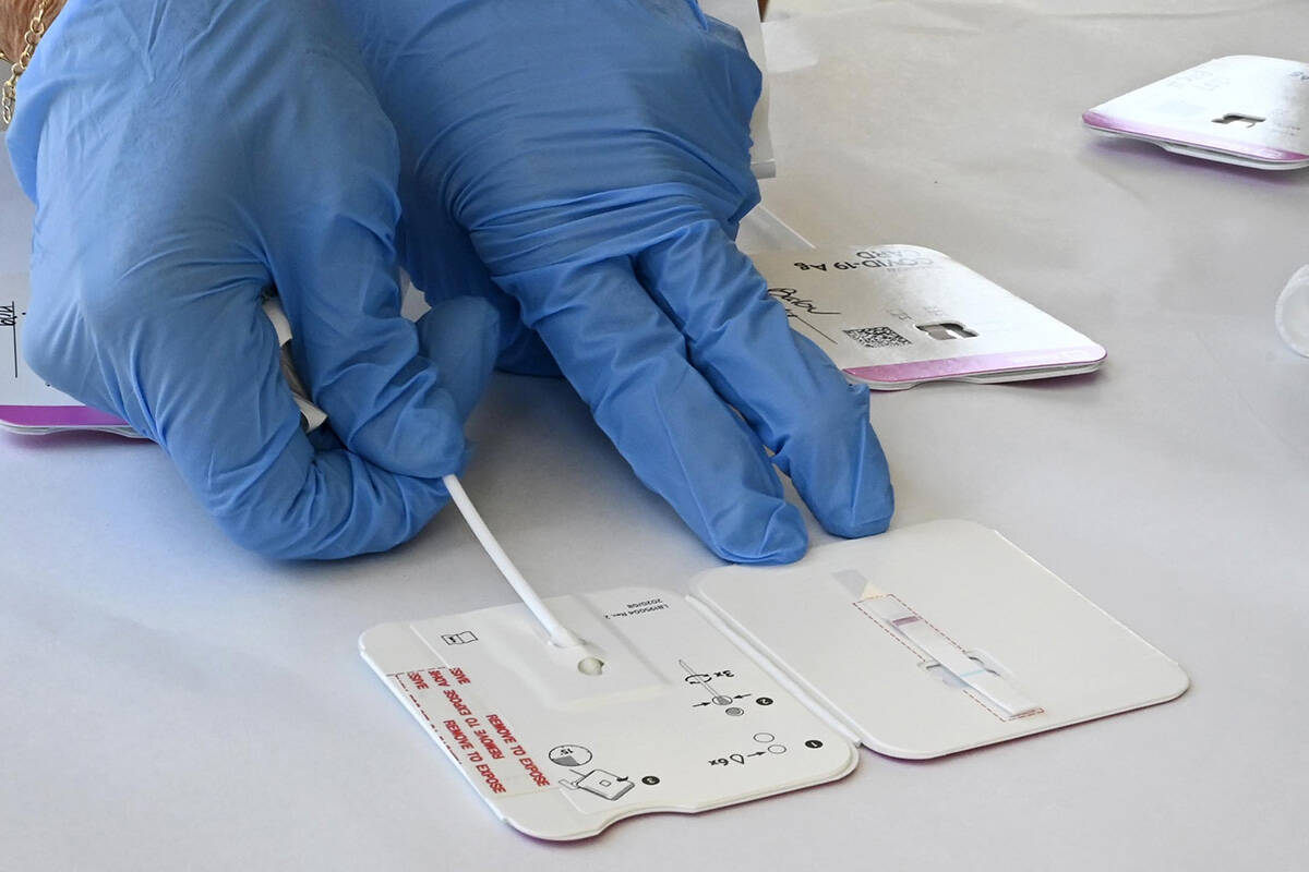 A rapid COVID-19 test swab. Both PCR and rapid antigen tests will be available for travellers or the general public at the Comox Valley Airport. (Brittany Murray/The Orange County Register via AP)