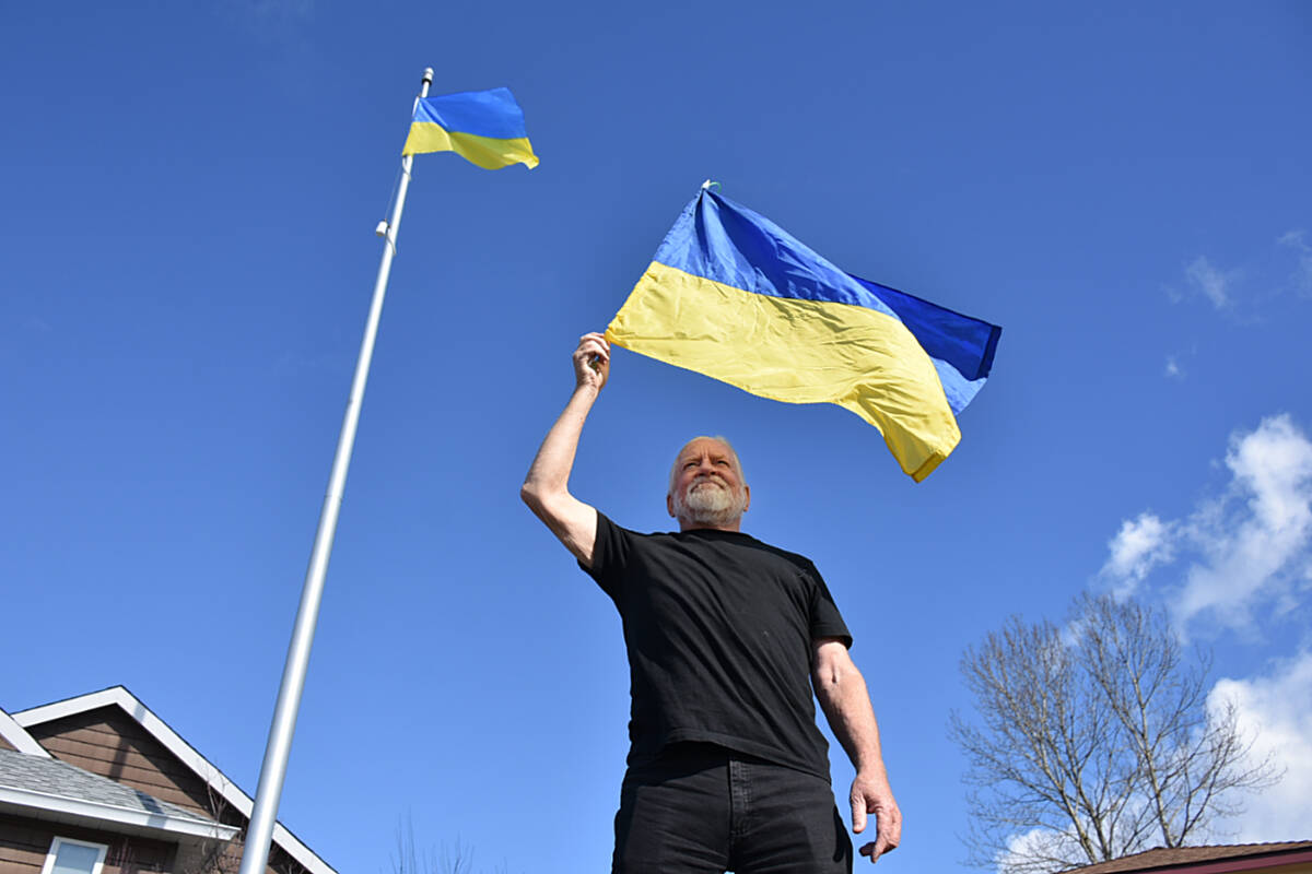 Chris Johnston is flying the Ukraine flag on the pole in the front of his home in Maple Ridge until the war comes to an end. (Colleen Flanagan/The News)