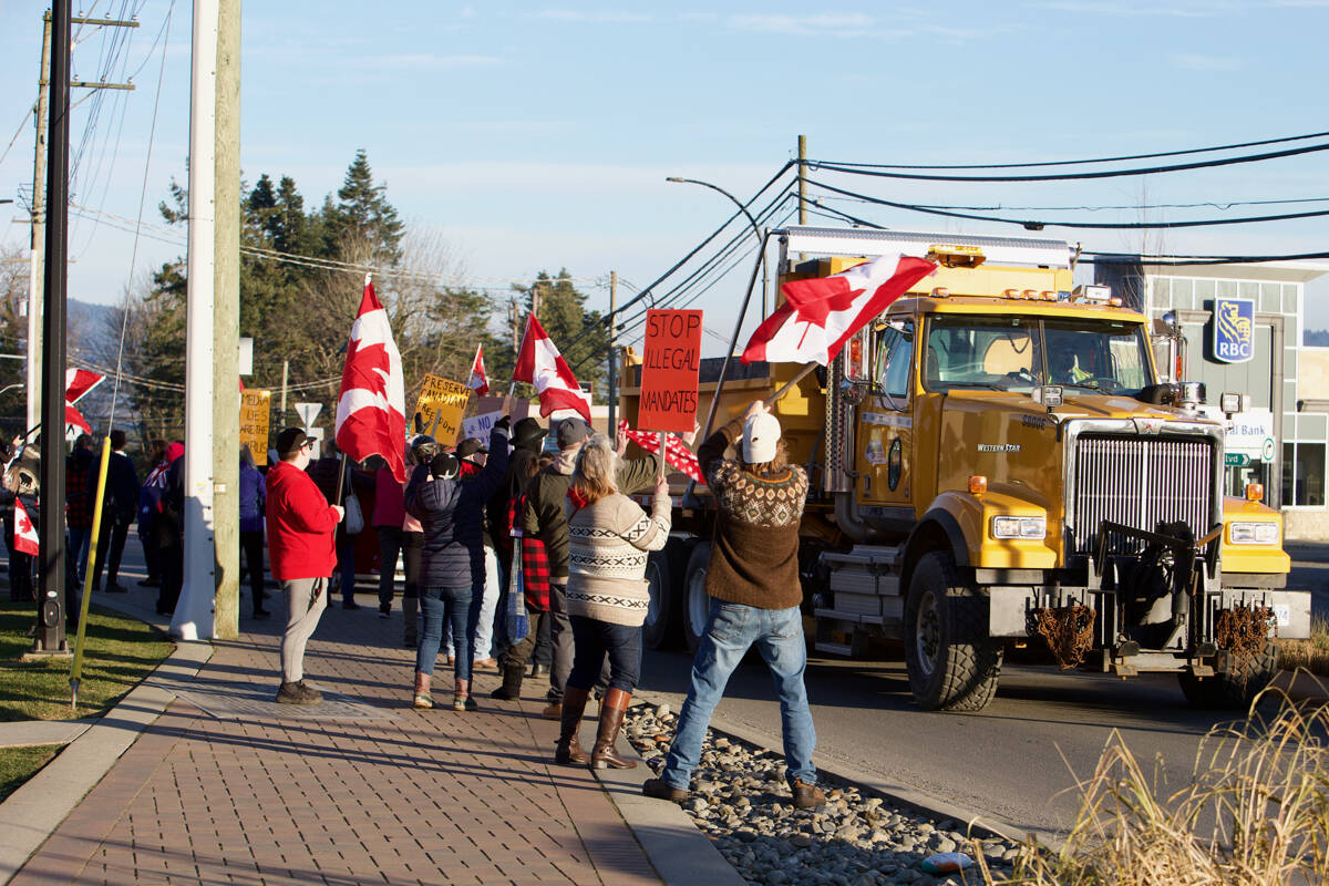 Demonstrators show their support for the “freedom convoy” in Sooke in February. Anti-vaccine mandate protests have clogged highways on Southern Vancouver Island for several weekends, and Victoria Police are preparing for a larger demonstration expected at the B.C. legislature on Monday, March 14.	(Justin Samanski-Langille/Sooke News Mirror)