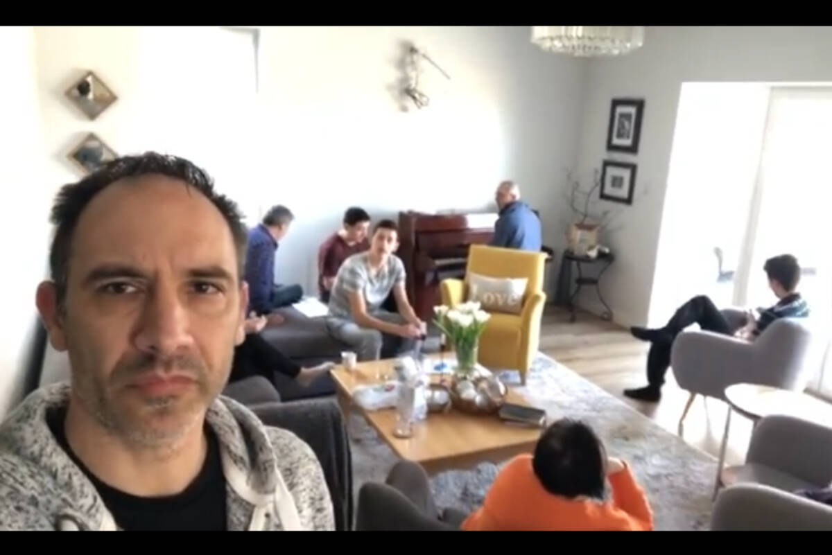 Screenshot from a video posted by Chad Martz in his home in western Ukraine on March 8, 2022. In the background people staying in his home sing a song as a send off to a gropu of refugees who are leaving. (Chad Martz Facebook)