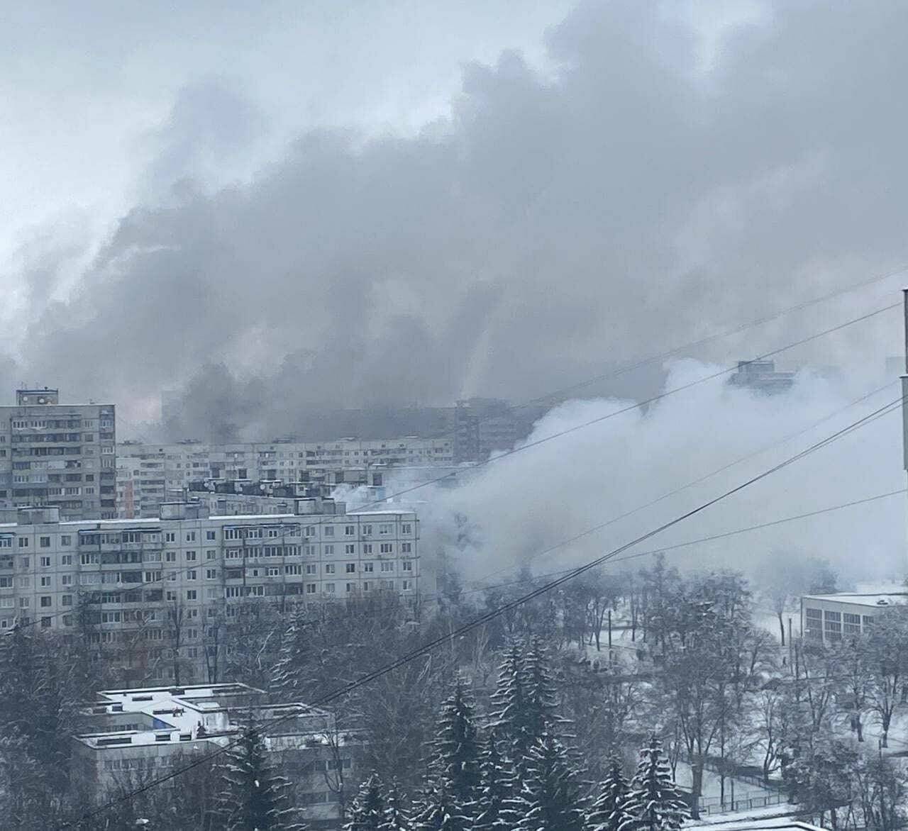 Smoke rises from Kharkiv apartment buildings following a Russian missile bombardment. The image is of an area near the family’s apartment building, taken by a friend of Straner’s father. Submitted photo.
